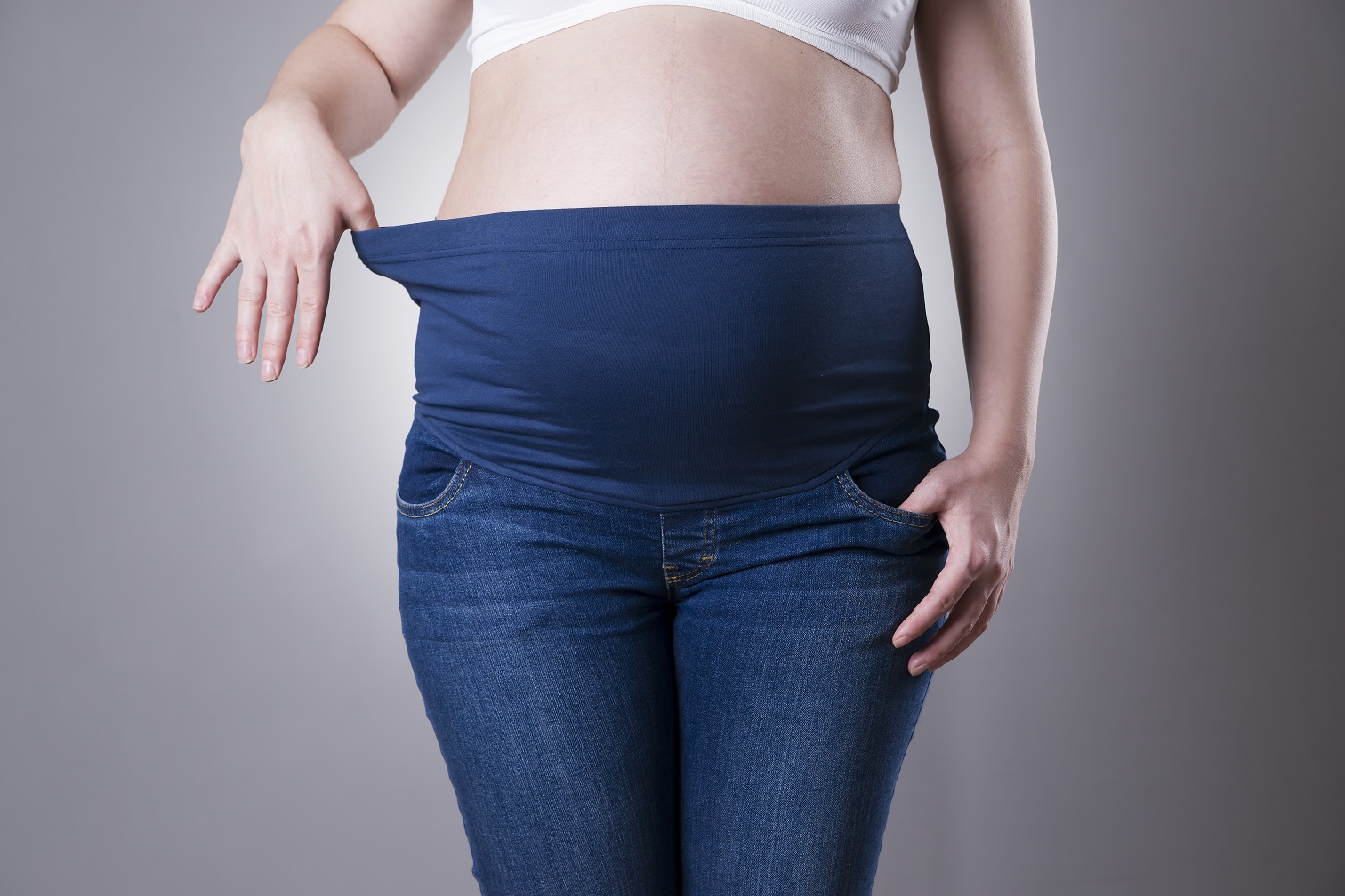 Pregnant Woman In Blue Jeans With High Waist Stock Photo  Download Image  Now  Pregnant Jeans Pants  iStock